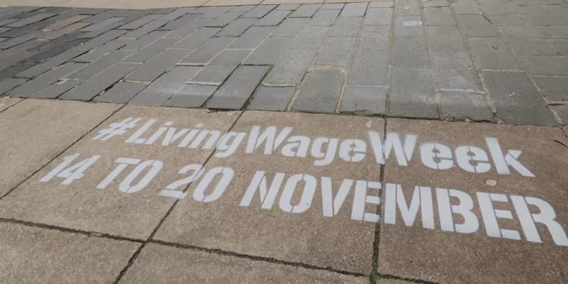 Living Wage Week message on pavement 
