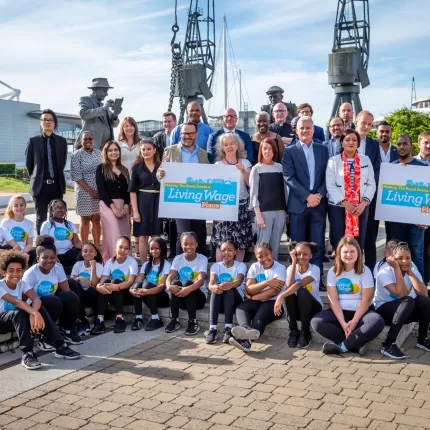Royal Docks Living Wage action group photo opportunity with sign
