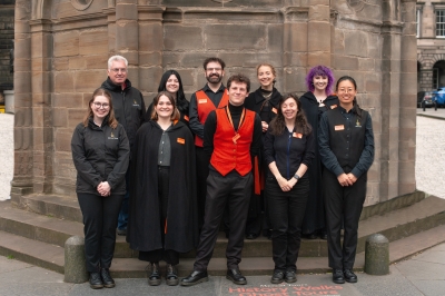 Mercat employees stand outside for a photo together